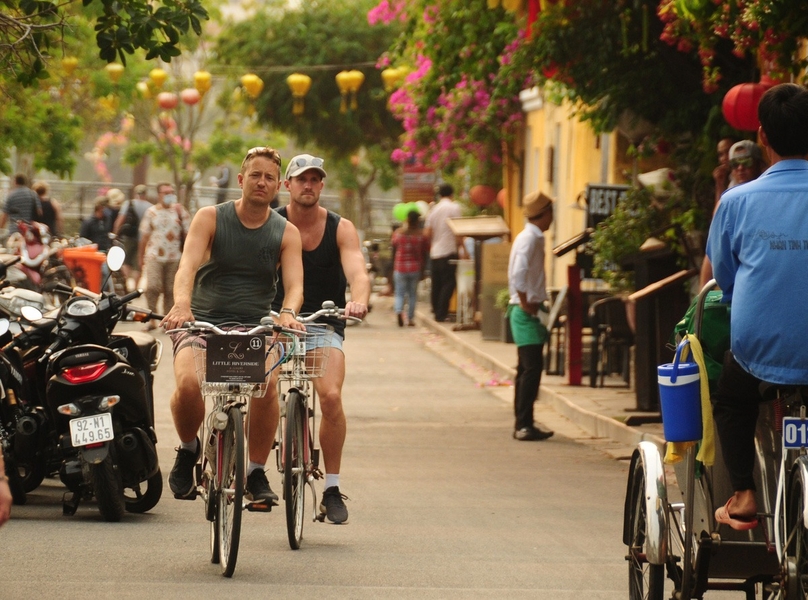 Foreigners cycle in the ancient town of Hoi An, Quang Nam province, central Vietnam. Photo courtesy of Tuoi Tre (Youth) newspaper.