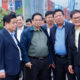 Prime Minister Pham Minh Chinh (front, second, left) listens to an introduction while visiting the Chu Lai seaport in Quang Nam province, central Vietnam. Thaco chairman Tran Ba Duong: front, first, right. Photo courtesy of the government's news portal.