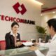 A customer conducts transactions at a branch of Techcombank. Photo courtesy of the lender.