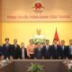 Minister of Industry and Trade Nguyen Hong Dien (6th from right) and Lao Ambassador to Vietnam Khamphao Ernthavanh (7th from right) have a working session in Hanoi on January 3. (Photo: tapchicongthuong.vn)